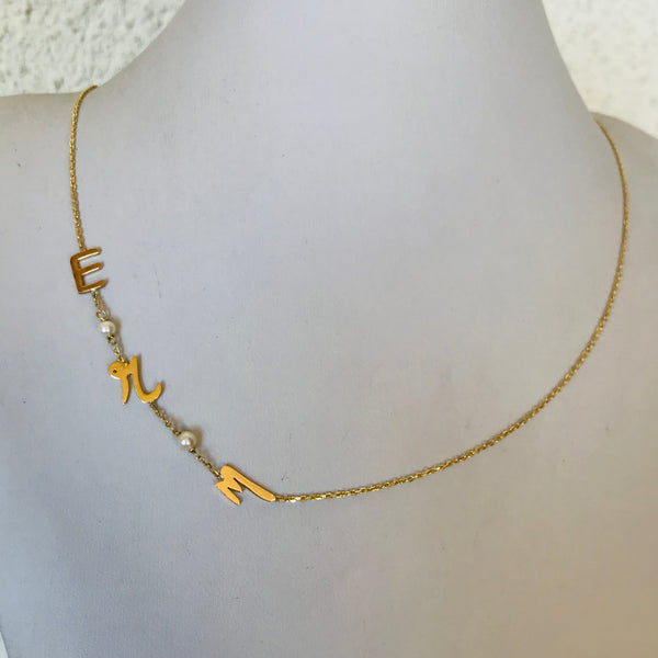Initials with small pearls