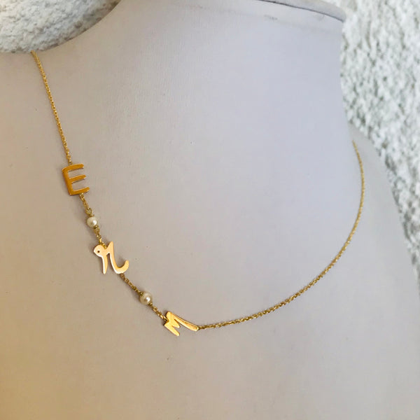 Initials with small pearls