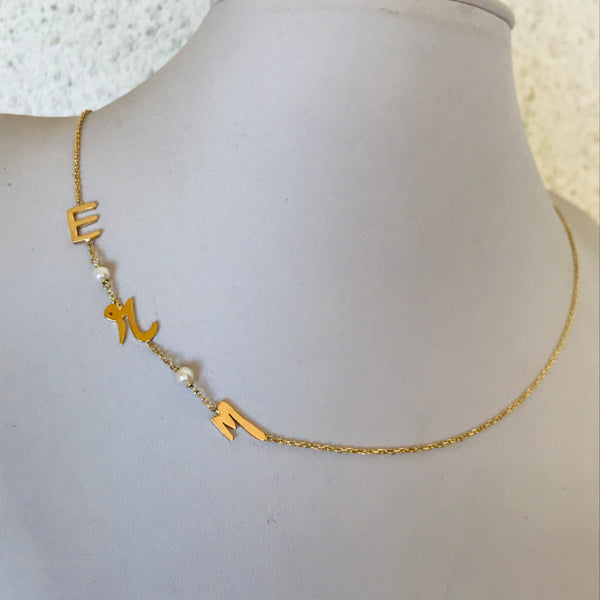 Initials with small pearls