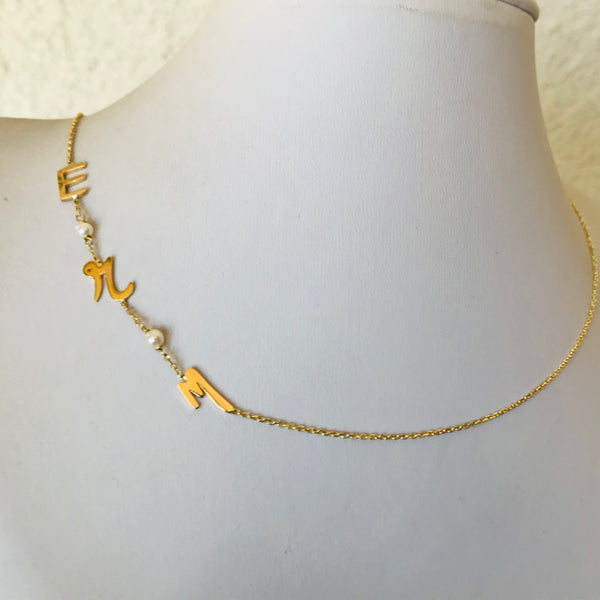 Initials with small pearls