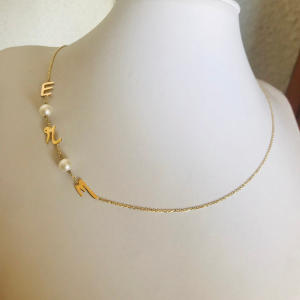 Initials with pearls
