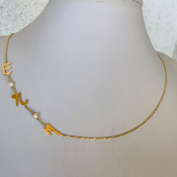 Initials with small pearls
