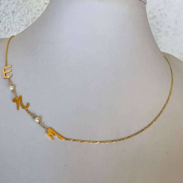 Initials with small pearls