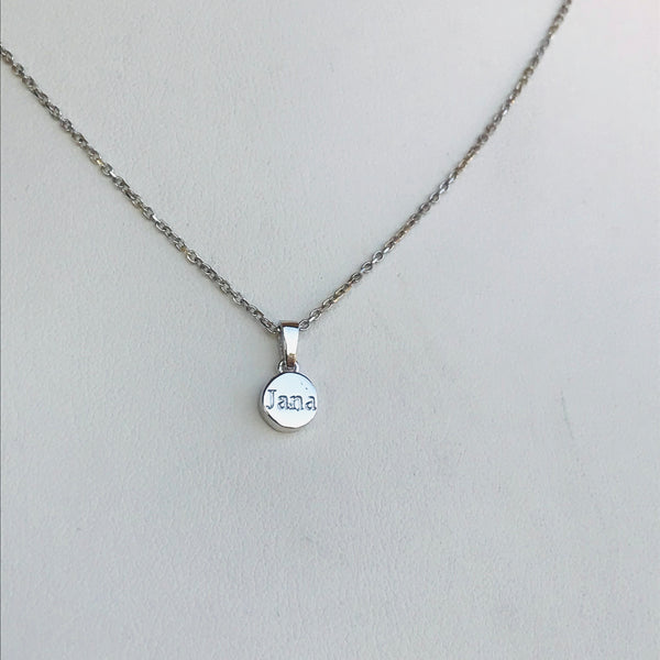 Nacre necklace and engraved word at the back